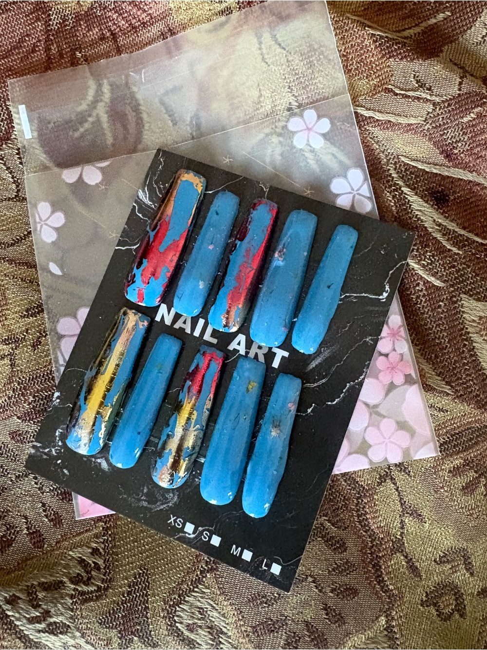 Blue Press-On Nails with Red & Gold Accents